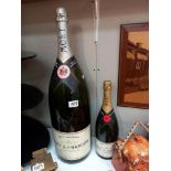 A display Salamanzar bottle of Moet & Chandon champagne & another display bottle of Moet & Chandon