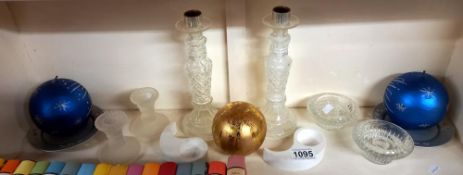 A quantity of candles and candle holders