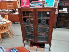 An Edwardian mahogany display cabinet with leaded glass doors COLLECT ONLY