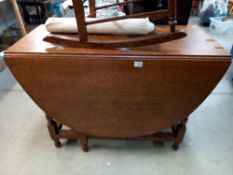 A 1930's large oak gateleg table COLLECT ONLY