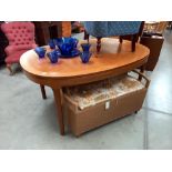 An extending teak dining table COLLECT ONLY