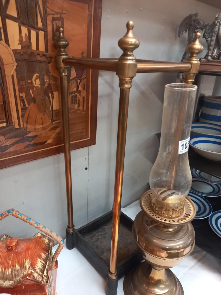 A brass stick/umbrella stand with cast iron base & an oil lamp COLLECT ONLY - Image 2 of 3