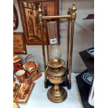 A brass stick/umbrella stand with cast iron base & an oil lamp COLLECT ONLY