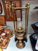 A brass stick/umbrella stand with cast iron base & an oil lamp COLLECT ONLY