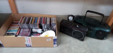 A Bush CD radio cassette, A Roberts radio alarm & a quantity of CD's & tapes COLLECT ONLY