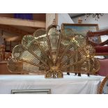A very attractive vintage brass fire screen folds out like a fan and folds away COLLECT ONLY