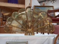 A very attractive vintage brass fire screen folds out like a fan and folds away COLLECT ONLY