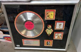 Platinum disc in frame, presented to Sandy Neese for 1000,000 sales of very best of Hank Williams