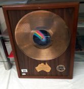 A Buddy Holly gold disc in frame, presented by Astor records, sales of 75,000.00 sales