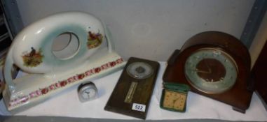 A ceramic clock case, a mantel clock, a barometer and two other clocks. COLLECT ONLY.