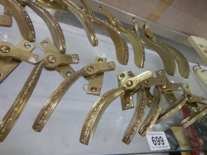 A quantity of vintage brass window catches. - Image 2 of 2