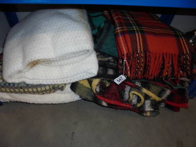 A quantity of blankets including picnic.