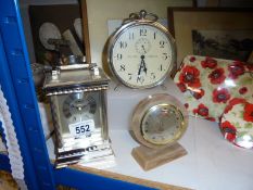 A carriage clock and two others.