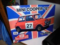A metal Mini Cooper "S" sign.