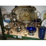 A mixed lot of silver plate including tray, teapot, bowls etc.,