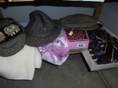 A mixed lot of hats, scarves, neck ties etc.,