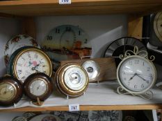 A mixed lot of clocks and barometers.