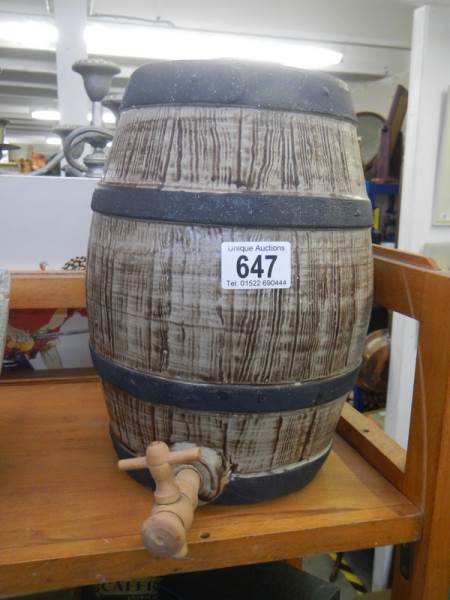 A mid 20th century pottery barrel with wooden tap.