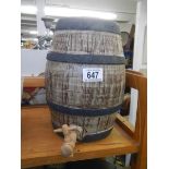 A mid 20th century pottery barrel with wooden tap.