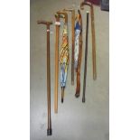 A quantity of walking sticks and umbrella's, COLLECT ONLY.