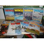 A quantity of Wings magazines.