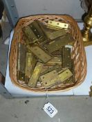 A quantity of brass hinges.
