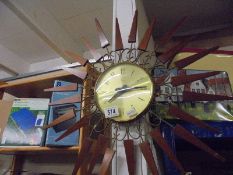 A vintage starburst clock. COLLECT ONLY.