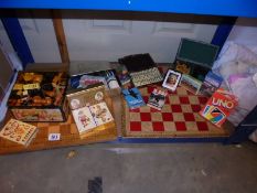 A mixed lot of games including signed and dated chess board.