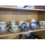 A mixed lot of tea cups and saucers.