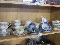A mixed lot of tea cups and saucers.