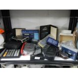 A Sony Walkman TPS-L" & a quantity of old calculators etc.
