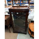 A dark wood stained cabinet