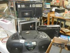 Two vintage radio cassette players, a radio and a radio CD player.