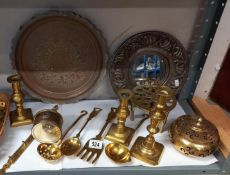 A mixed lot of brass ware including candlesticks, trivet, wine coaster etc.,