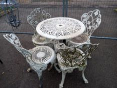 A vintage cast table and four chairs, COLLECT ONLY.