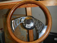 A wood rim batwing steering wheel with boss.