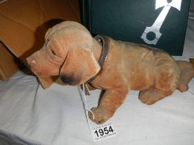 A vintage German made nodding dog.