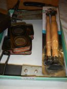 Three vintage tins of Carborundum valve grinding paste, pair of lappers and a valve lifting tool,