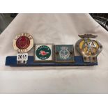 Caravan Club and AA car badges etc., on bracket.