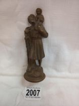 A bronze figure of St. Christopher car mascot.