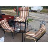 A glass topped metal outside table and four chairs, COLLECT ONLY.