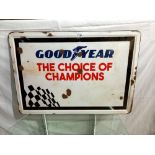 An enamel Goodyear Champions sign, 92 x 64 cm, COLLECT ONLY.