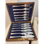 An oak cased silver plate set of fish knives and forks by Cross Bros Cardiff