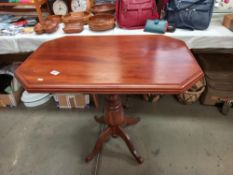 A mahogany tea table with rectangular octagonal top on centre column with 4 legs COLLECT ONLY