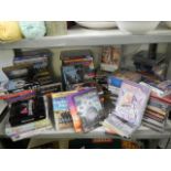 A large lot of CD's and DVD's.