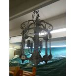 A wrought iron exterior porch lantern.