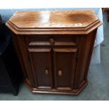 An oak veneered 2 door, 1 drawer cupboard COLLECT ONLY