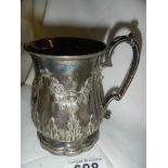 An early 20th century embossed silver plate jug.