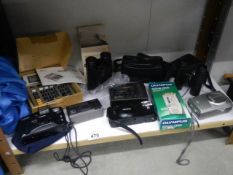 A mixed lot of camera's and binoculars etc.,