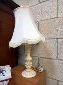 A painted wooden ormalu style table lamp
